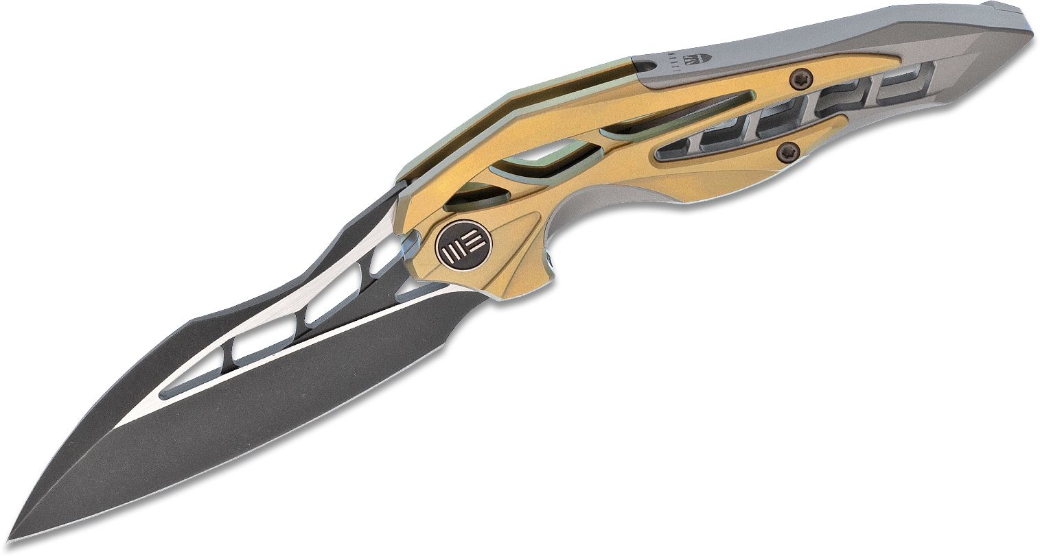 We Knife Company 906A Elijah Isham Arrakis Flipper Knife 3.45" M390 Black Two-Tone Blade, Gold and Gray Titanium Handles | Buy We Knife Company... We Knife Company 906A Elijah Isham Arrakis Flipper Knife 3.45" M390 Black Two-Tone Blade, Gold and Gray Titanium Handles | Buy We Knife Company... - Image 1